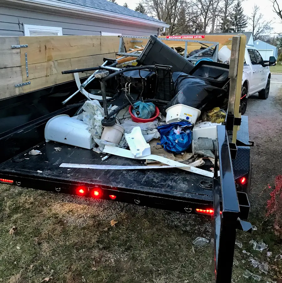 Roll-off dumpster delivered to a residential driveway in Acme